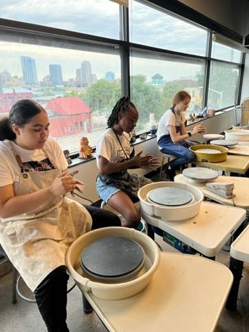 Middle school summer campers making pottery at WMCAT